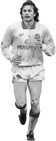 AIM-FOR co-founder Lee Richardson whilst playing for Blackburn Rovers in the early 90's running forward during a match, captured mid-stride with classic long-sleeve shirt and Perspex sponsor badge.