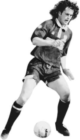 AIM-FOR co-founder Nick Richardson whilst playing for Cardiff City in the early 90's controlling the ball during play, shown in motion with a focused expression.
